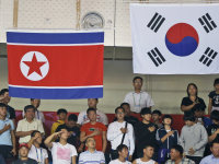 National flags of North Korea, left, and South Korea hang side by side  