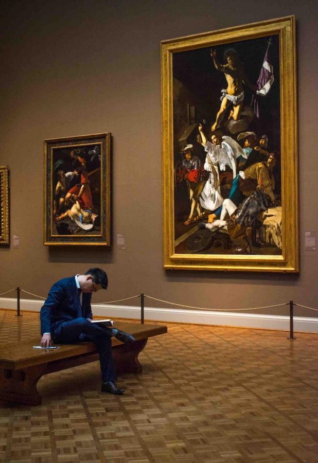 A visitor relaxes in the Art Institute of Chicago.