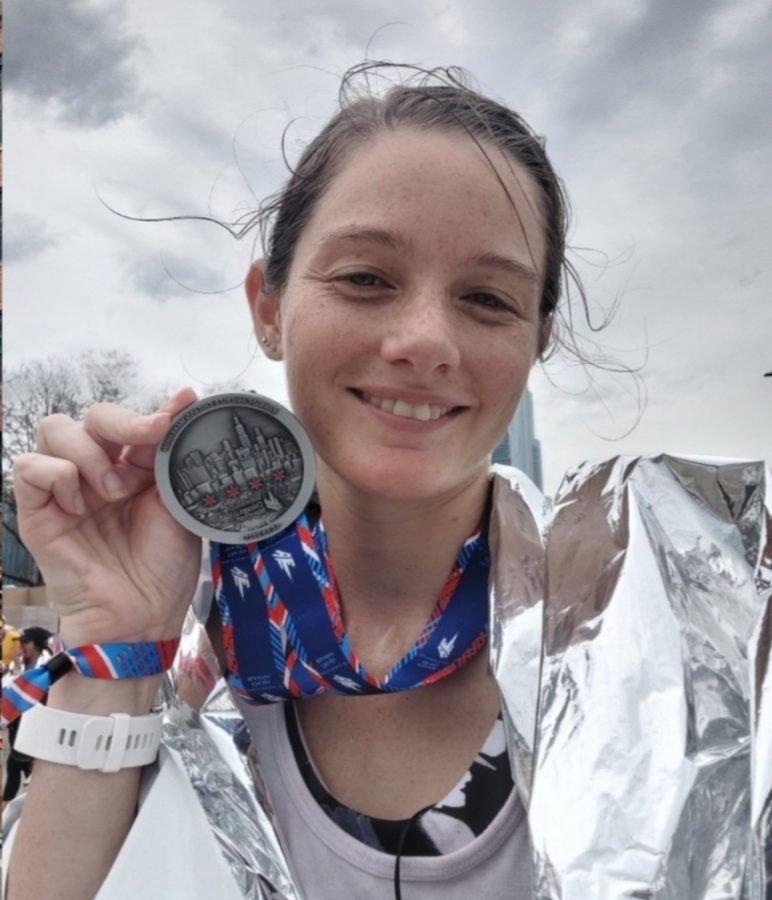 Rachel Schaeffer shows off her Chicago Marathon medal